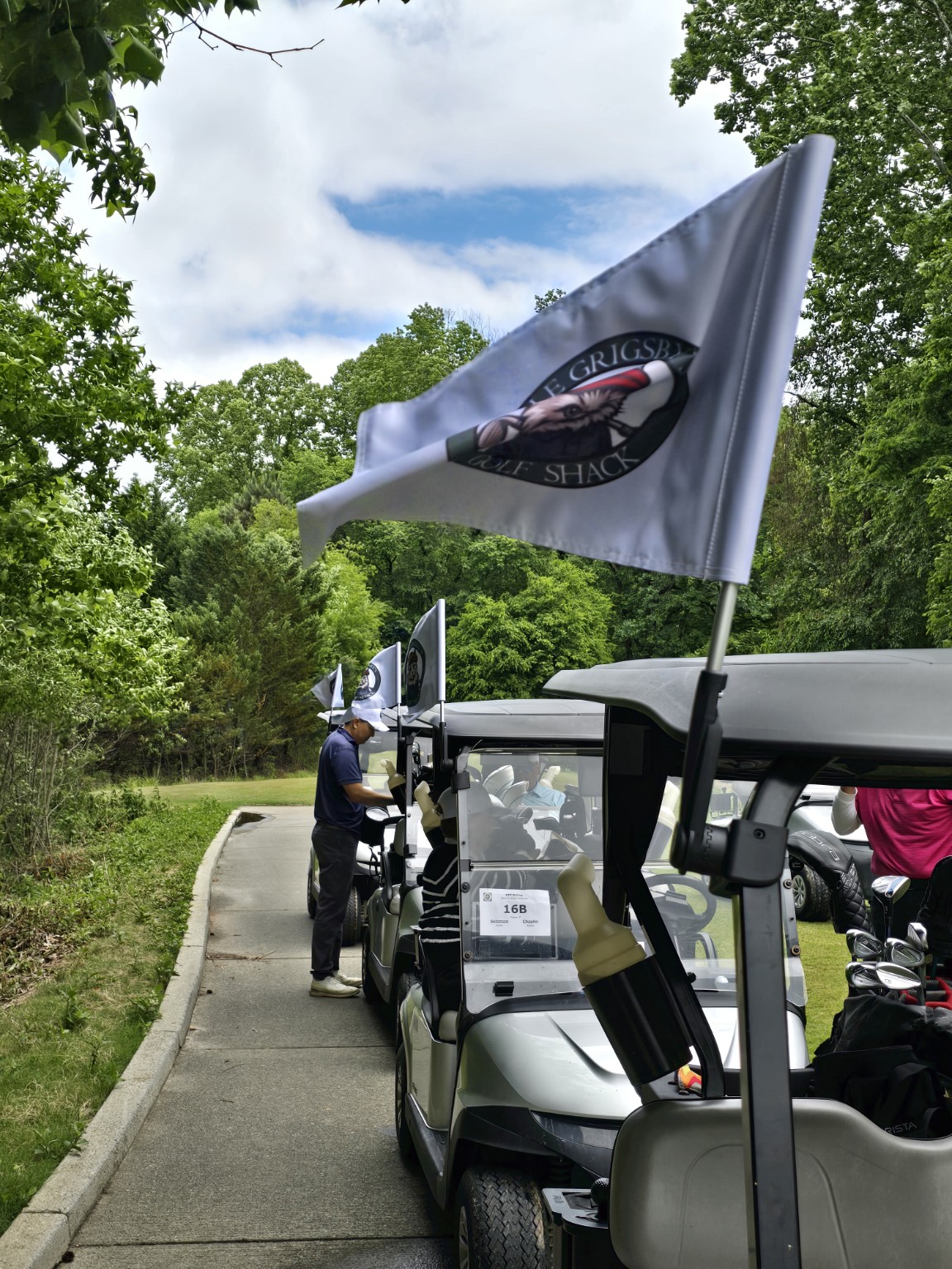 Uncle Grigsby flag flying from a tournament golf cart
